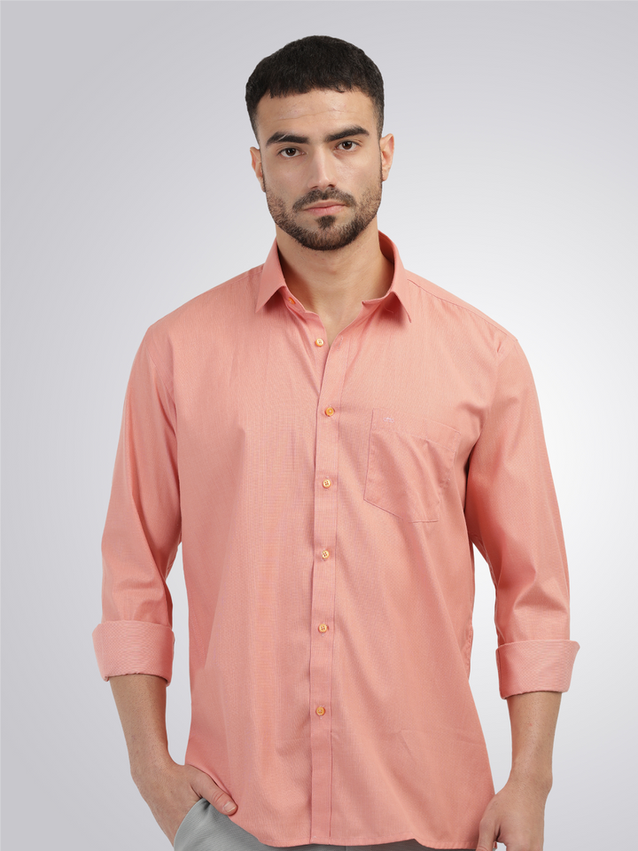 peach color shirt